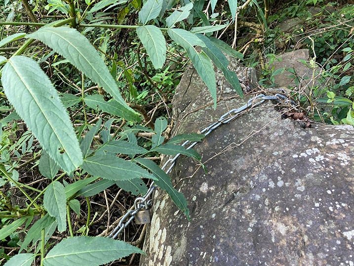 Chain attached to a boulder