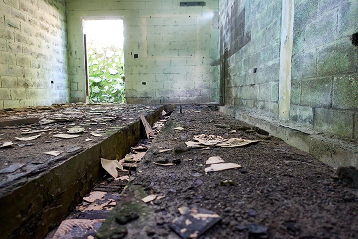Dirty floor of abandoned building - door to back left - channel in ground - PingBuCuoShan - 坪埔厝山
