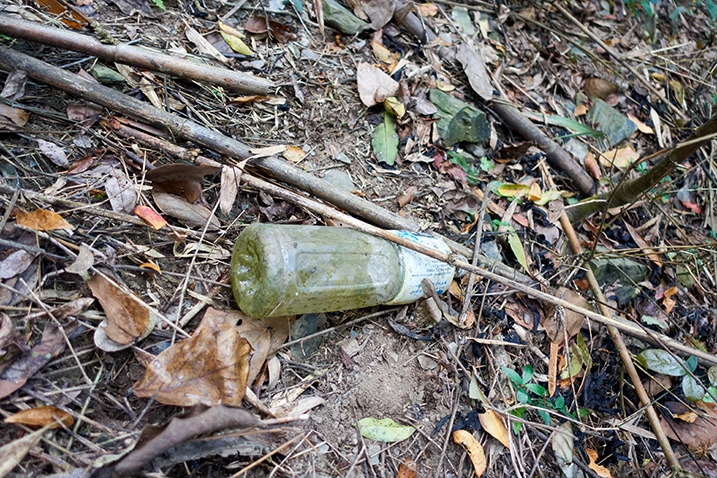 Old plastic bottle on ground