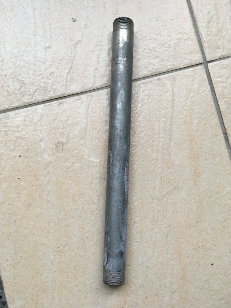 Metal pipe on tile floor