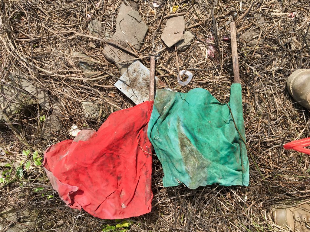 Red and green flags on ground - looks old