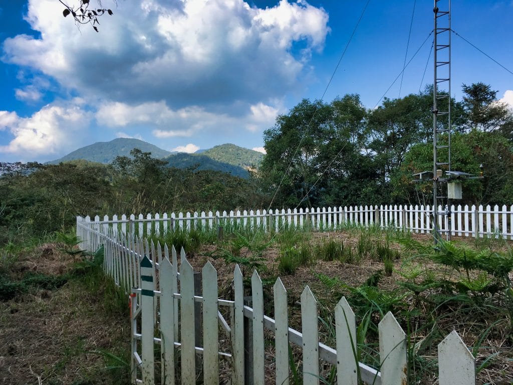 Sunshan Weather Station - 森山氣象站 - surrounded by white picket fence - Mountains and blue skies