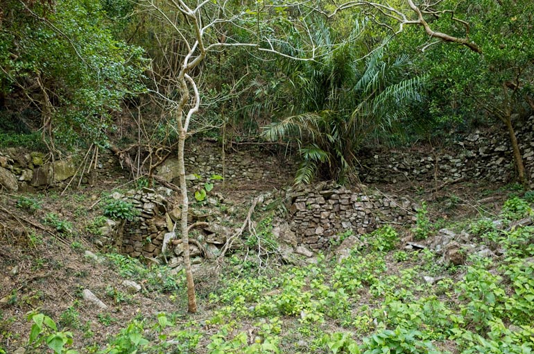 Rocks stacked on side of the mountain