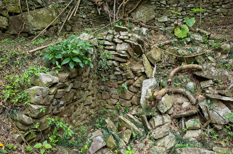 Rocks stacked on side of the mountain