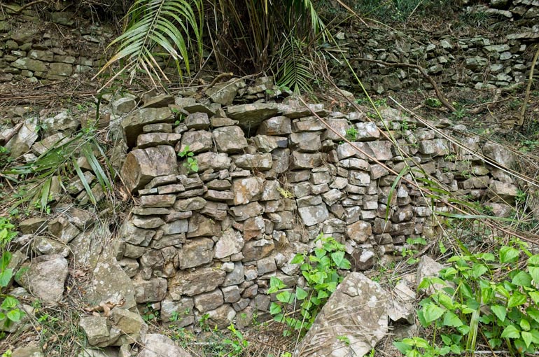 Rocks stacked on side of the mountain