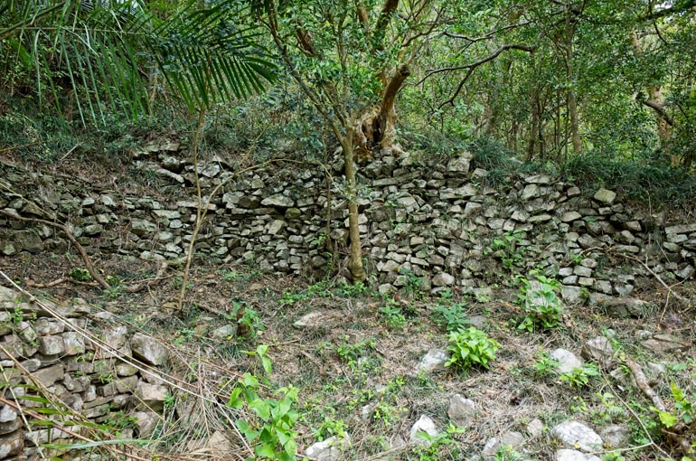 Rocks stacked on side of the mountain