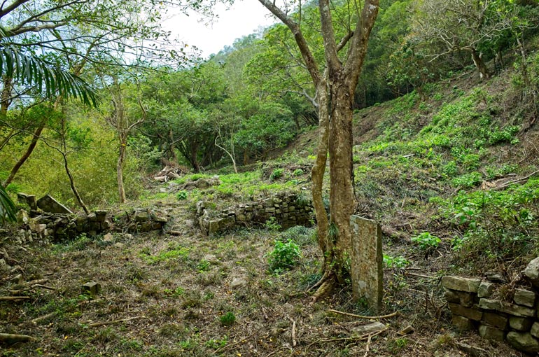 Open area with stacked rocks towards back