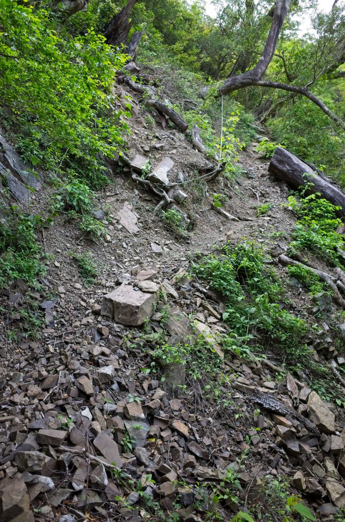 Loose rocky incline with rope