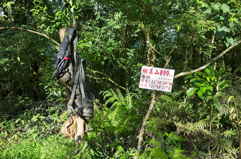 My molle vest hanging from a tree - Pengjishan sign to the right