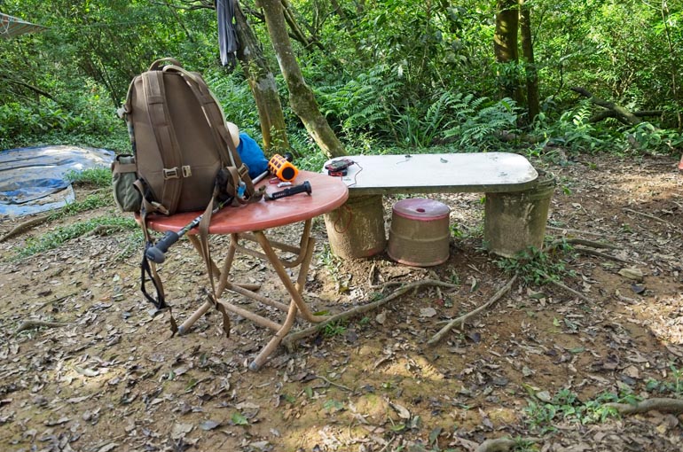 My backpack and gear on a small table