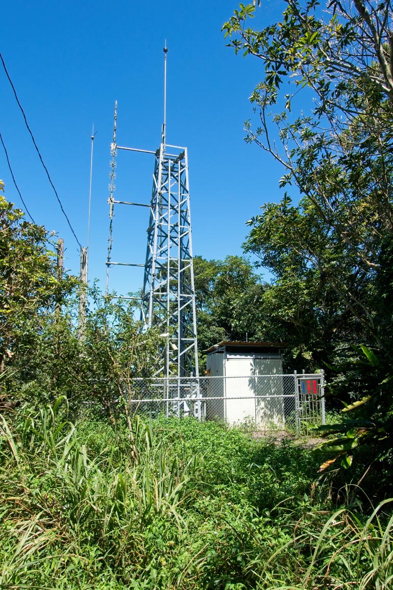 Radio or transmission tower surrounded by a fence