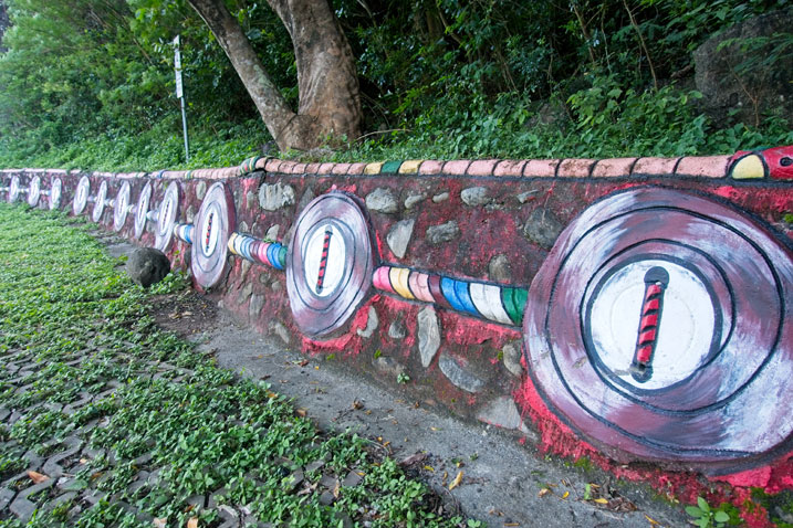 Retaining wall with aboriginal artwork painted on side