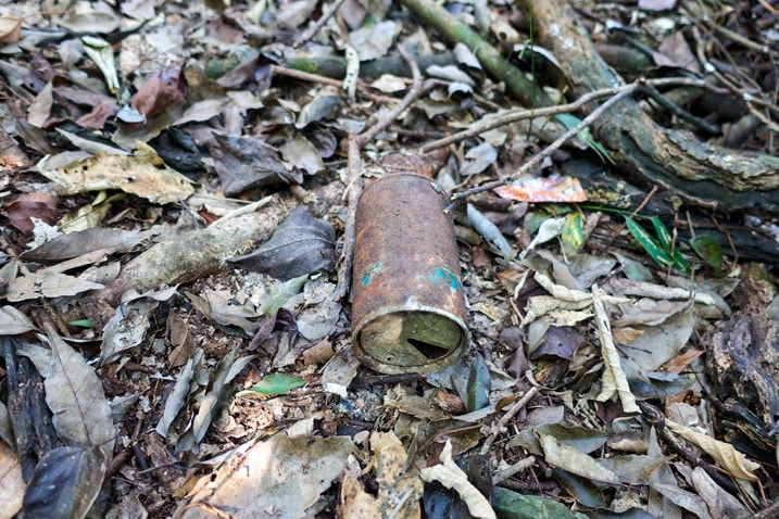 Old rusty can on ground