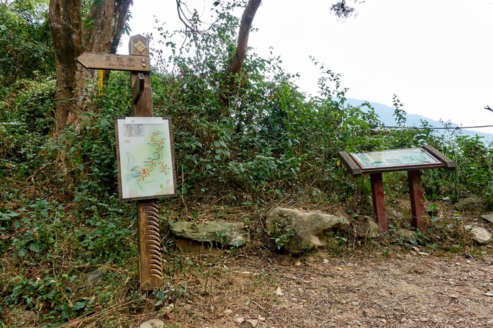 Signs posted on a dirt road - WeiLiaoShan Hike – 尾寮山