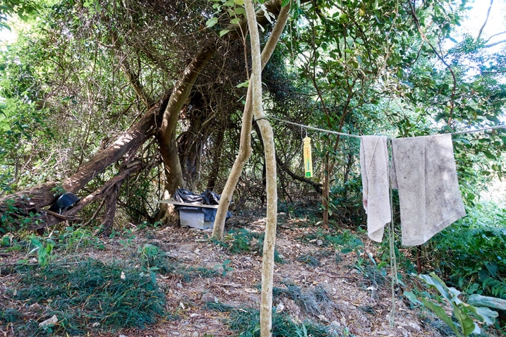 Old table and clothesline with towels hanging - trees in the background - WeiLiaoShan Hike – 尾寮山