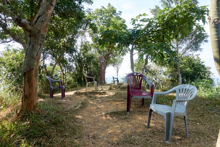 Open area with many plastic chairs and trees - 人頭山 - 旗月縱走
