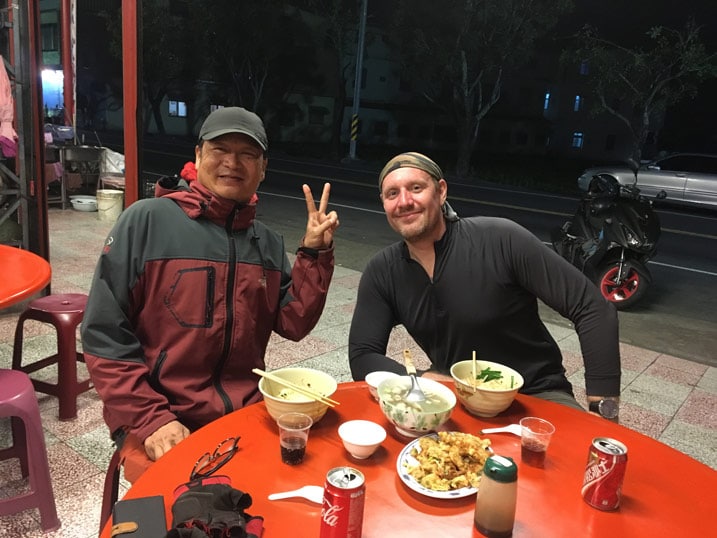 Two men eating dinner at table - 旗月縱走