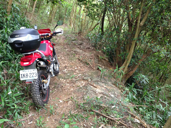 Red Hartford VR Motorcycle on dirt road lined with trees - WuTanShan - 武潭山