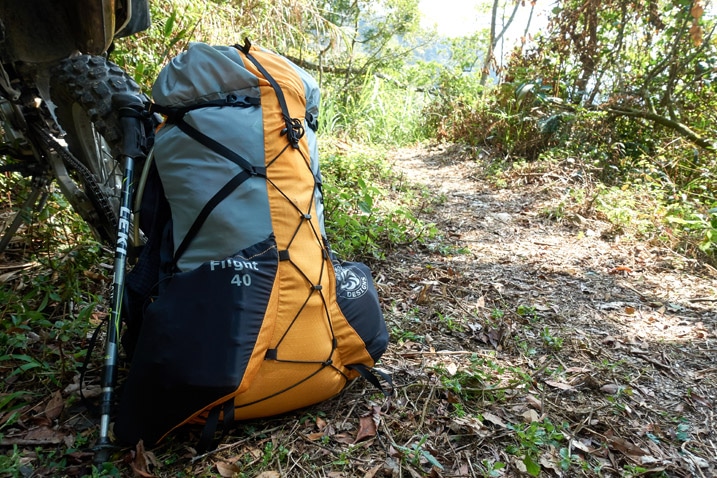 Six Moon Designs Flight 40 Backpack next to motorcycle on trail