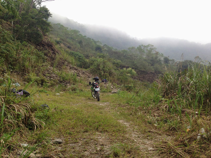 motorcycle at end of dirt road