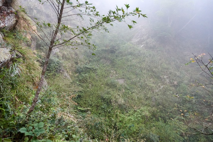 Looking down at steep drop-off next to trail