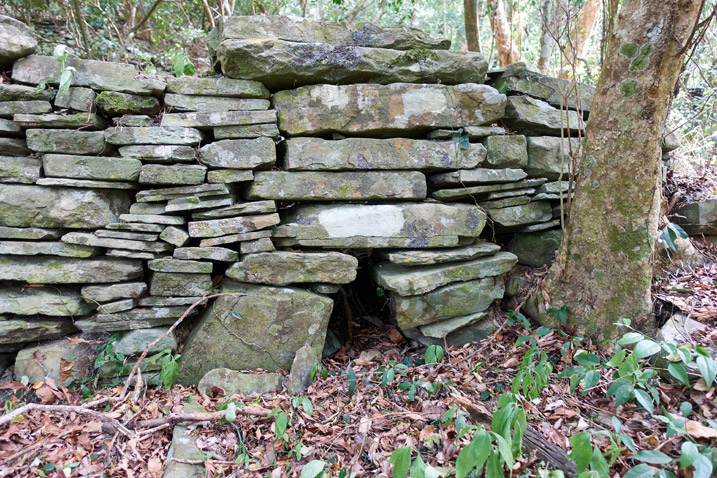 Stones stacked like a wall - hole at bottom