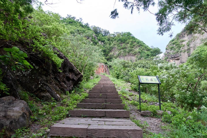 Stairs leading up mountain