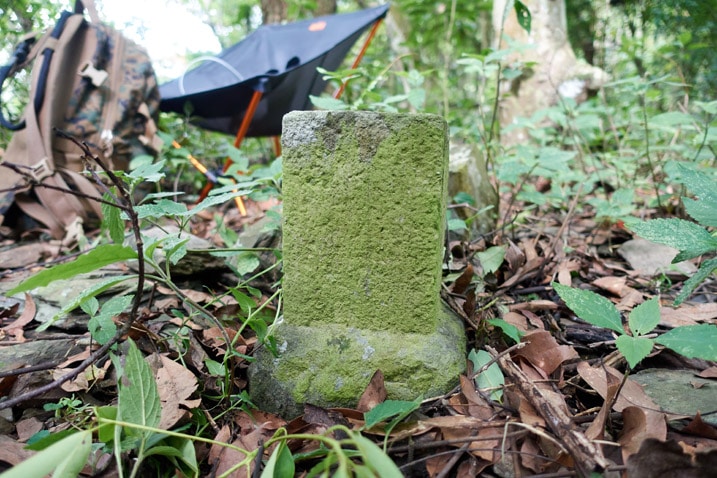 Closeup of triangulation stone - chair in background