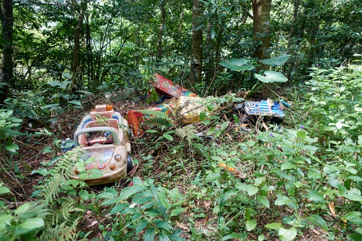 Old children's toys dumped in the mountains