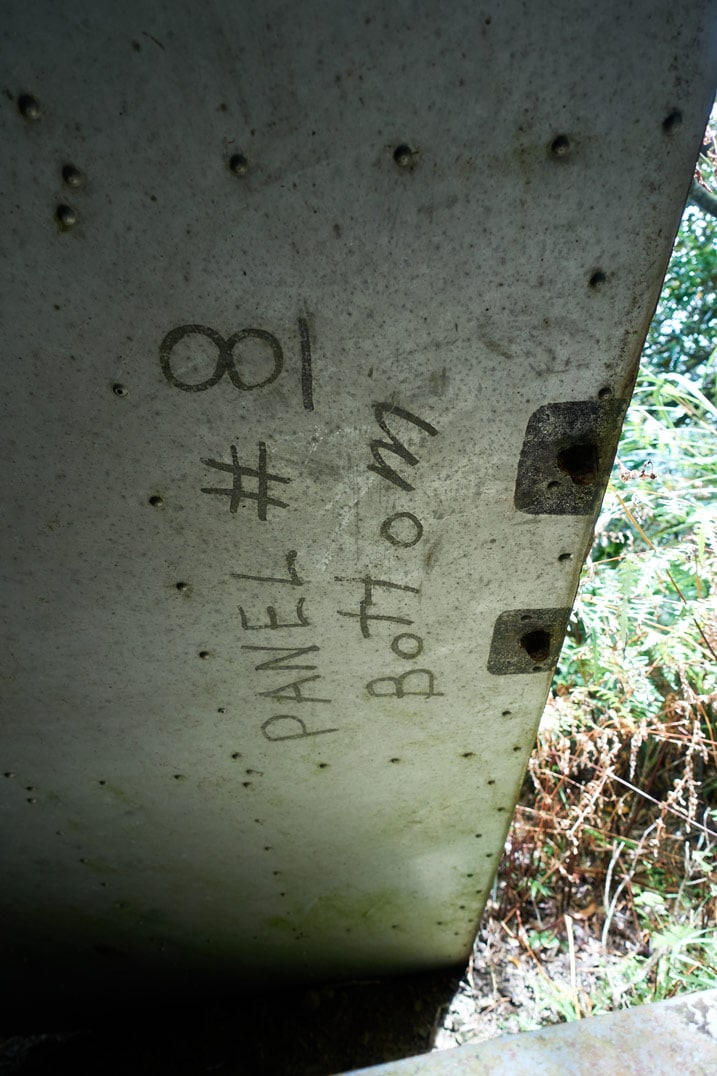 Closeup of remains of Passive radio repeater - "PANEL #8 Bottom" written on side