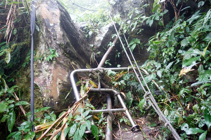 Lots of railings tied together as sort of steps to climb up rocks