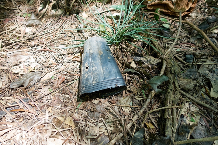 Closeup of old black plastic farming planter